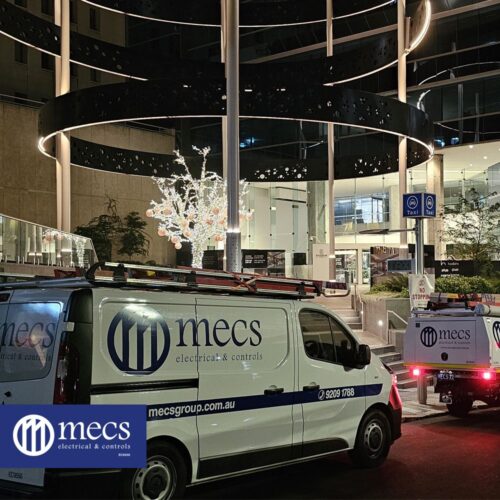 MECS Electrical & Controls service truck parked outside a building, representing industrial electrical contractors on-site