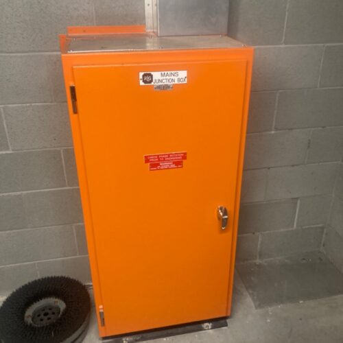 Orange electrical cabinets at Coles facility during switchboard replacement by an industrial electrical company in Perth
