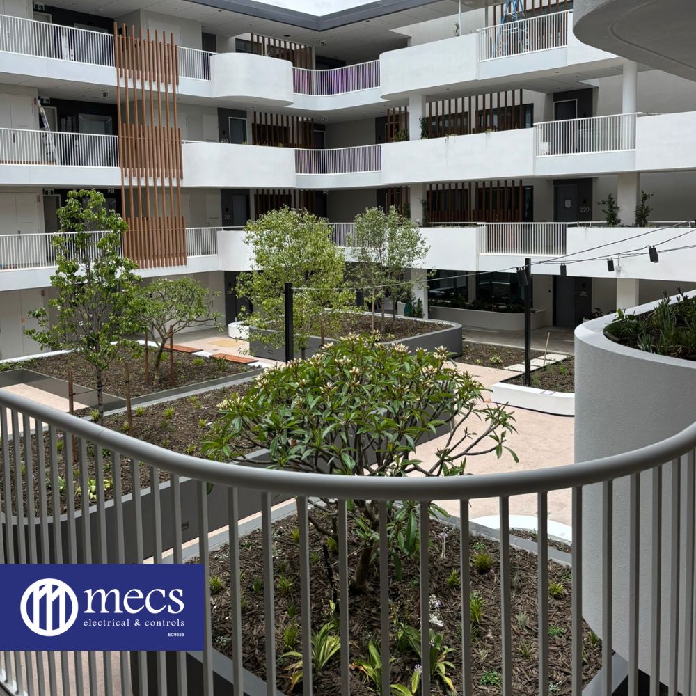 Lush plants frame mechanical electrical and controls installation courtyard at St Ives by an industrial electrical contractor