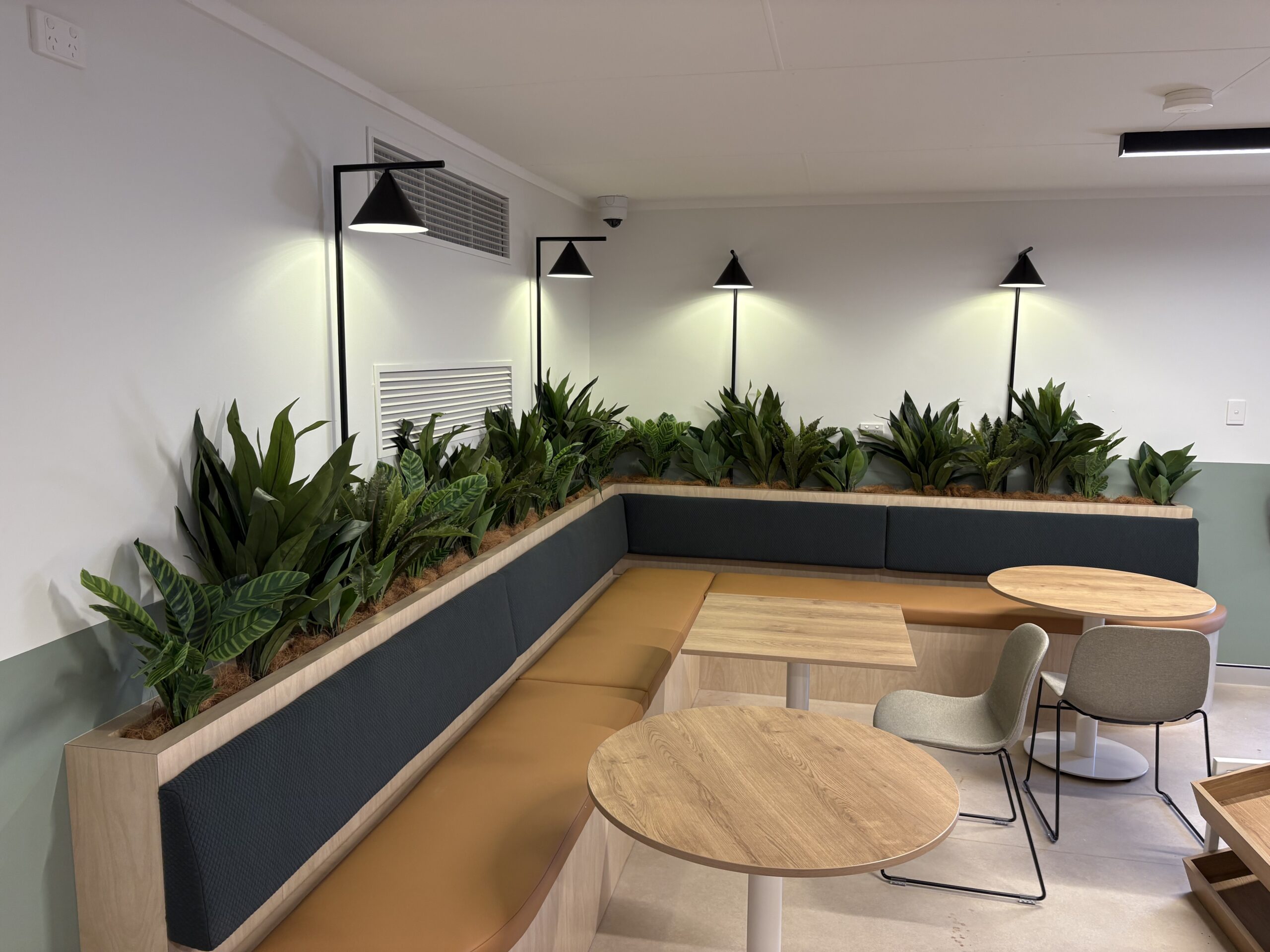 Indoor workspace with bench, plants and table at Whaleback and Kalgan dry mess after electrical upgrade by an electrical mechanic
