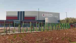 Large building with green fencing where MECS installed HVAC control system for climate management solution